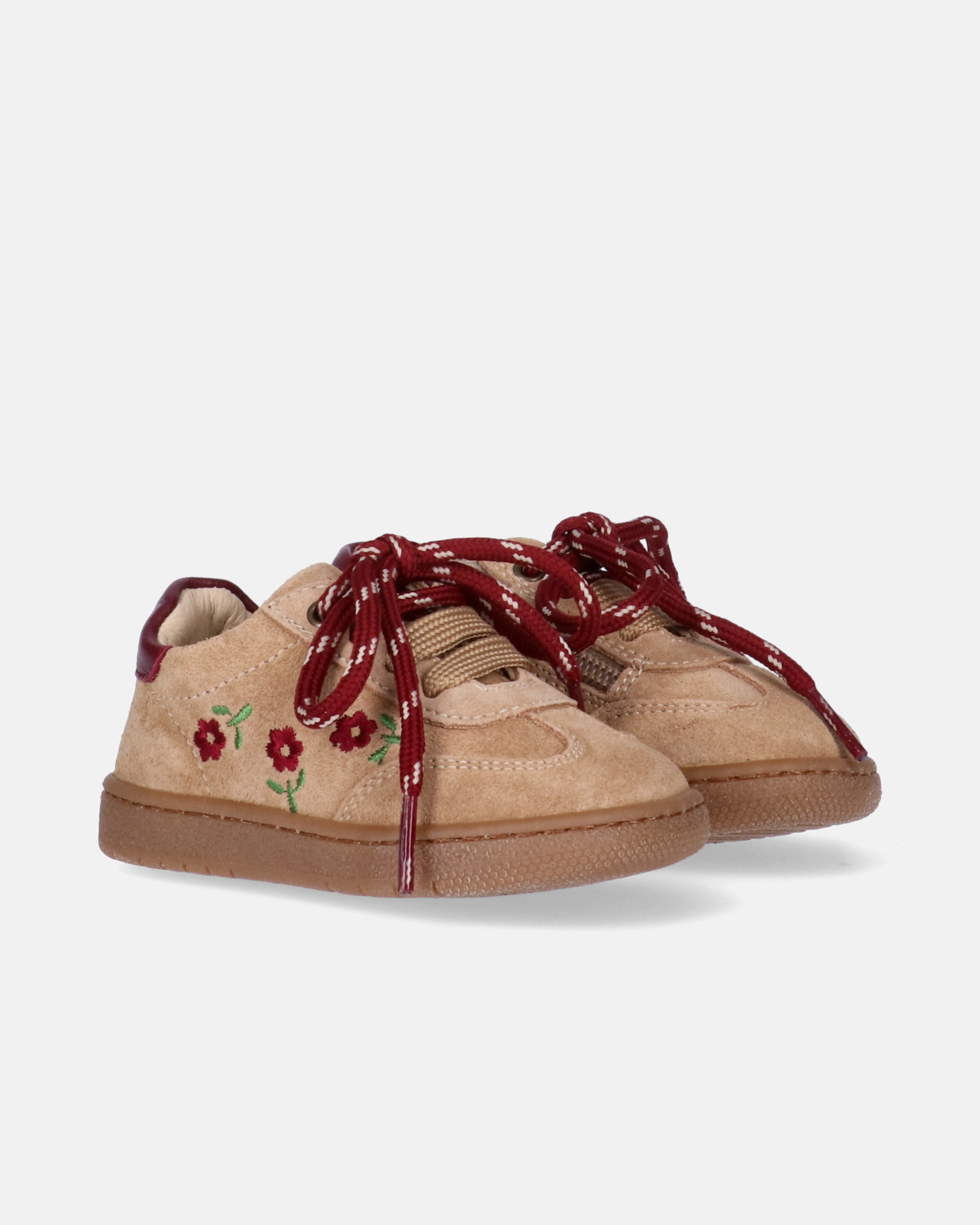 Sneakers da bambina beige Walkey con fiorellini ricamati e lacci colorati.